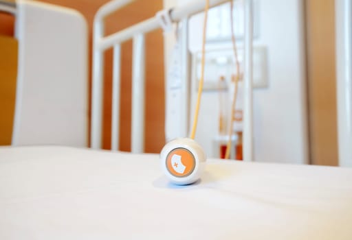 Emergency button for calling nurse equipment on bed