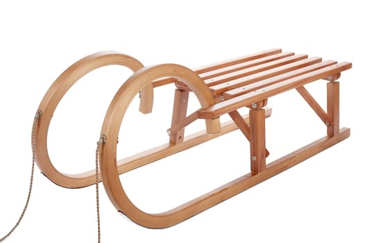 Wooden sledge isolated on white background.