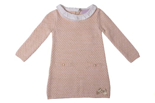 Clothes for children. Pink baby girl dress with white lace collar and a golden bow isolated on a white background. Children fashion.