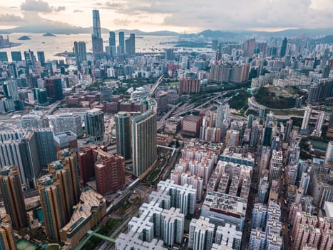 Top view aerial photo from flying drone of a HongKong Global City with development buildings, transportation, energy power infrastructure. Financial and business centers in developed China town