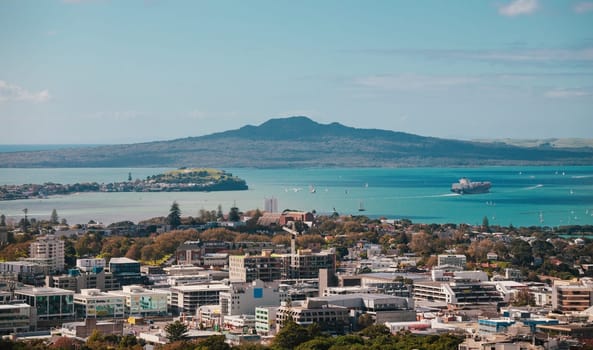 Auckland view from Mt Eden with a person walking along the path towards the city, New Zealand