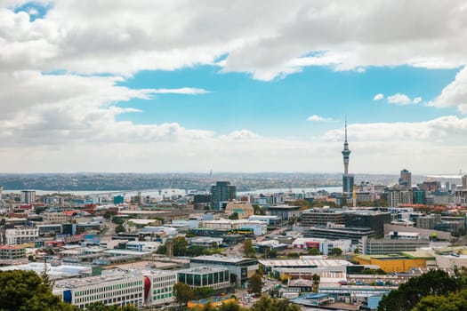 Auckland view from Mt Eden with a person walking along the path towards the city, New Zealand