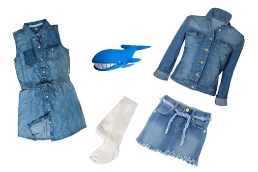 Collection jeans clothes on white background. Collection of blue jeans clothes for girls isolated on a white background. Childrens spring and summer fashion.