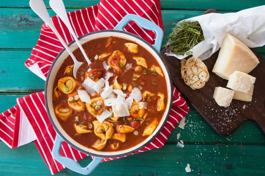 Delicious tortellini in a tomato sauce / soup in a pan