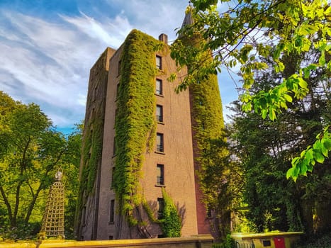 Flat high brick house block with tower
