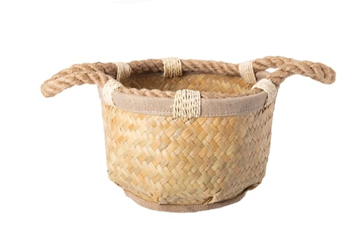 Empty straw basket with handles of rope isolated on white background. For your food and product display montage.