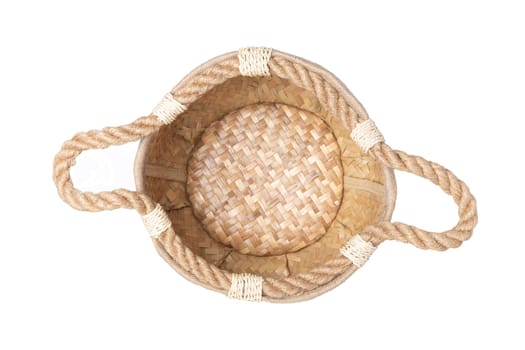 Empty straw basket with handles of rope isolated on white background. For your food and product display montage. Top view.