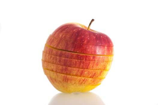 isolated on white background isolated closeup red bright, juicy fresh apple sliced into slices.