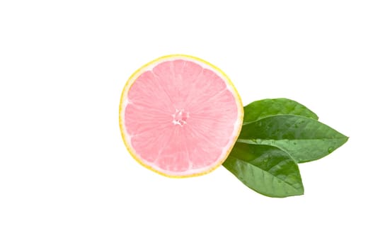 Half of a fresh, clean, glowing pink lemon with green leaves on a white background.