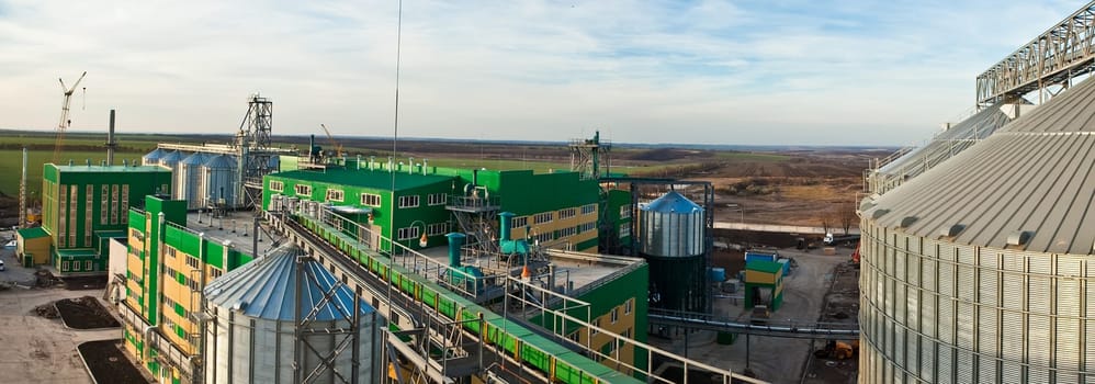 Towers of grain drying enterprise. metal grain facility with silos