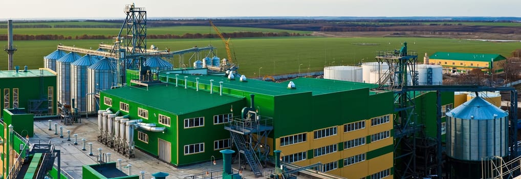 Towers of grain drying enterprise. metal grain facility with silos