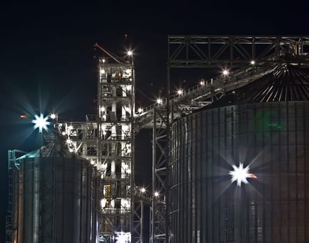 Towers of grain drying enterprise. metal grain facility with silos