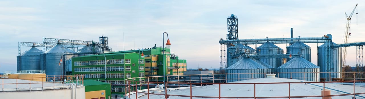 Towers of grain drying enterprise. metal grain facility with silos