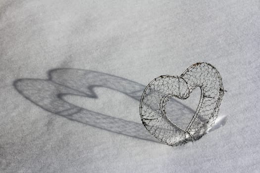 A heart with shade in the snow