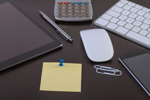 Office desk with digital tablet smartphone keyboard and mouse. Business workspace concept with blank paper for your text.