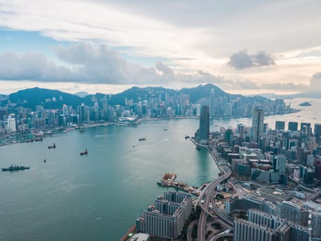 Top view aerial photo from flying drone of a HongKong Global City with development buildings, transportation, energy power infrastructure. Financial and business centers in developed China town