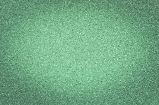 Texture of granite green color with small dots, with vignetting.