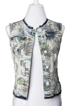 Women clothes. Sleeveless blue jeans vest or jacket for woman on mannequin  isolated on a white background. Jeans fashion.