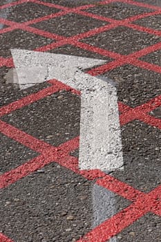 Turn left direction arrow at tarmac