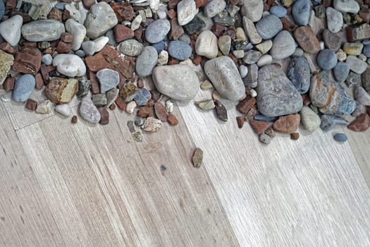 Rocks and stones at wood background decor