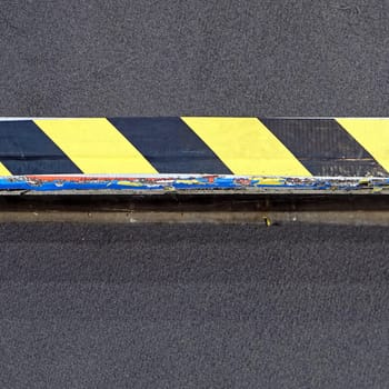 Yellow and black safety tape at step warning