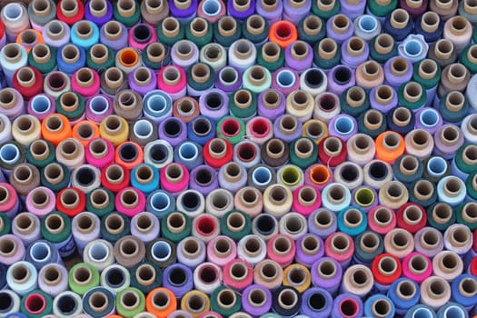 Colorful sewing threads and yarns background