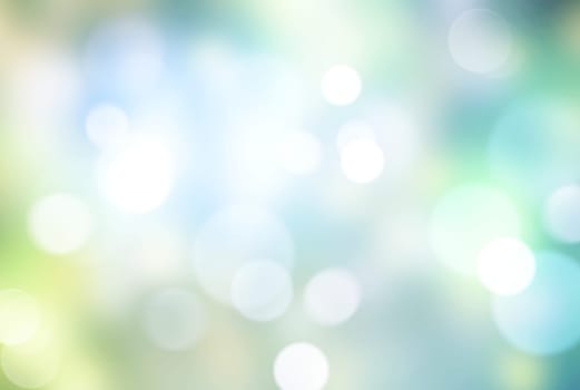 Abstract blurred green blue gradient pastel background texture with white bokeh circles.