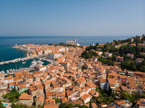 Aerial view of old town Piran. Splendid summer day on Adriatic Sea. Beautiful cityscape of Slovenia, Europe. Traveling concept background. Magnificent Mediterranean landscape.