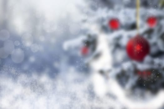 Christmas or Happy New Year background. Abstract blurred christmas or Happy New Year background with snow and red christmas balls. Beautiful texture.