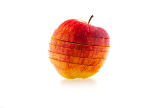 one sliced red apple on a white background