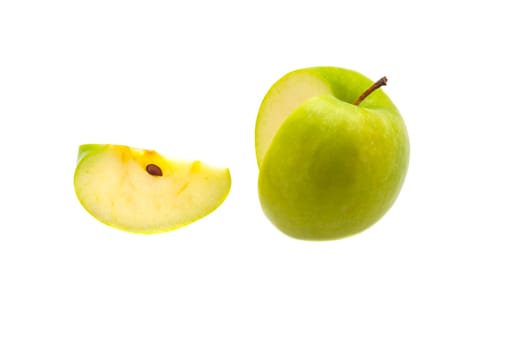 A single slice of a large green apple was cut off. On a white background.