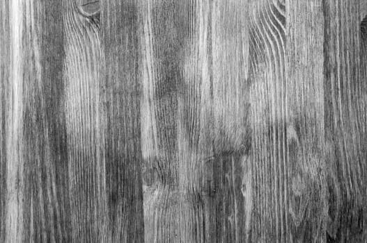 Black and white background of wooden boards arranged vertically.