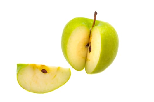 Slice is cut off from a large fresh green apple.