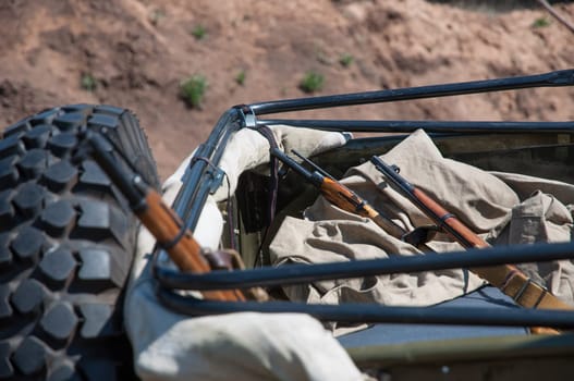 Rifle and a military machine during the II World War. Reconstruction of hostilities 2018-04-30 Samara Region, Russia.