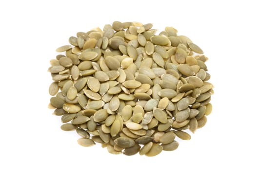 Sunflower seeds in the center, in the shape of a circle, on a white background.
