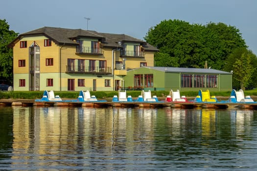 House and reflection on the river Daugava in Latvia.
