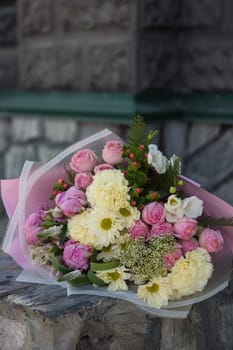 Female hands holding beauty wedding bouquet