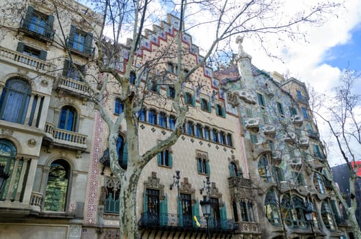 BARCELONA, SPAIN -MARCH 5: View of street with the Casa Batllo is  designed by Antoni Gaudí, and  one of his masterpieces. The local name for the building is House of Bones in Barcelona, Spain on March 5, 2018.