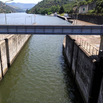 View of the canal connecting the lock to the upstream of the Douro River on the Regua Dam, also called Bagauste Dam, Portugal