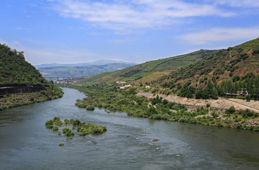 Superb panorama looking downstream the Douro River from the Regua Dam, also called Bagauste Dam, Portugal