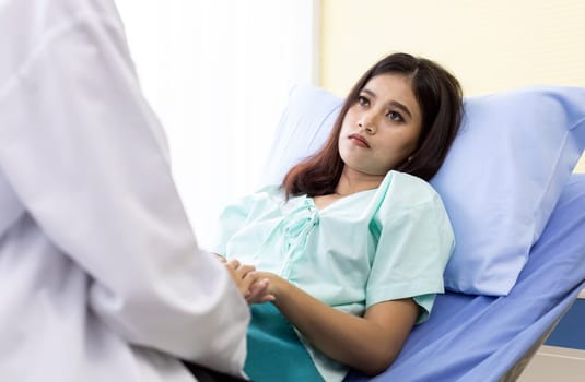 Patient fell worry when Asian Doctor make routine health check in hospital ward