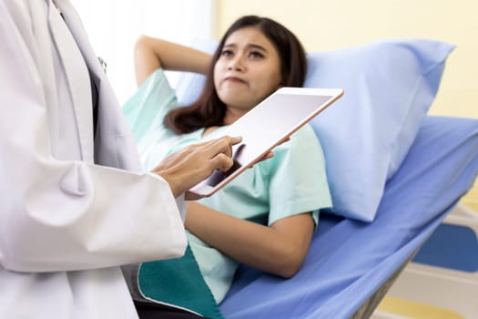 Patient fell worry when Asian Doctor make routine health check in hospital ward