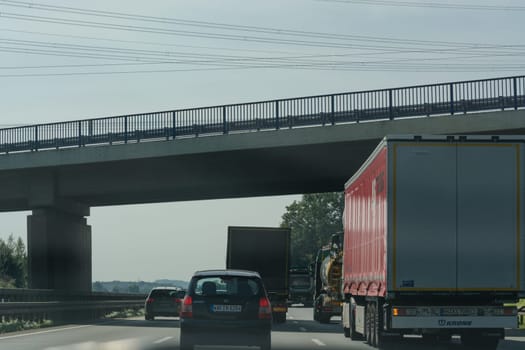 UNNA, GERMANY - AUGUST 23, 2017: Traffic on the A2 motorway and Scholven coal power station, Germany, North Rhine-Westphalia.