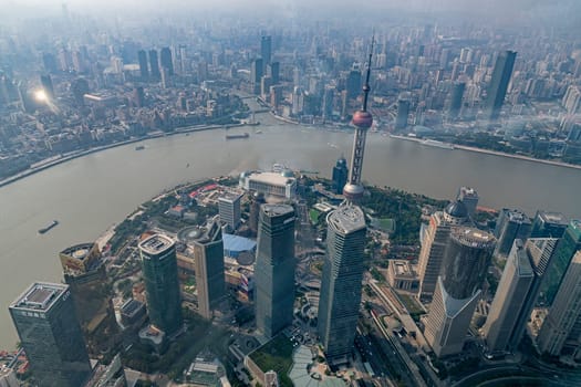 View from Shanghai Tower (height 632 m) to Oriental Pearl Tower and Bund,Pudong,Shanghai,China,Asia