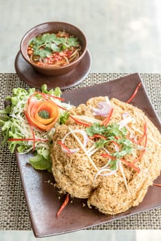 Crispy catfish salad with green mango sauce