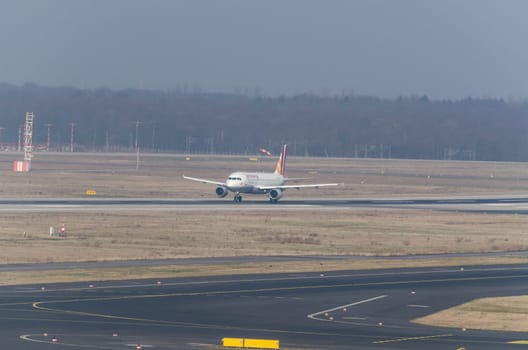 Dusseldorf, Nrw, Germany - March 18, 2015: Up, Airplane Dusseldorf. View of the tarmac. Large passenger airplane at the gate.
