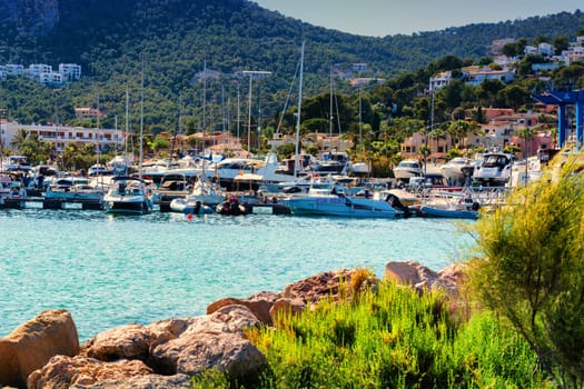 PORT ANDRATX, SPAIN - JUNE 01, 2017:.View of the Bay of Port Andratx Mallorca Baleares Spain. In the background motor boats and sailboats.