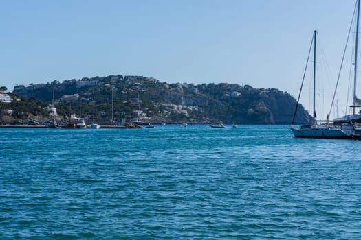 PORT ANDRATX, SPAIN - JUNE 01, 2016:.View of the Bay of Port Andratx Mallorca Baleares Spain. In the background motor boats and sailboats.