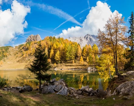 Colorful autumn morning in the mountains. Colourful autumn morning in mountain lake. Colorful autumn landscape. Lake of Borfaglia, Friuli, Italy.