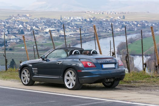 LEIWEN, GERMANY - MARCH 26, 2016:.Chrysler Crossfire on the Panorama Trail in the vineyards of Leiwen an der Mosel.